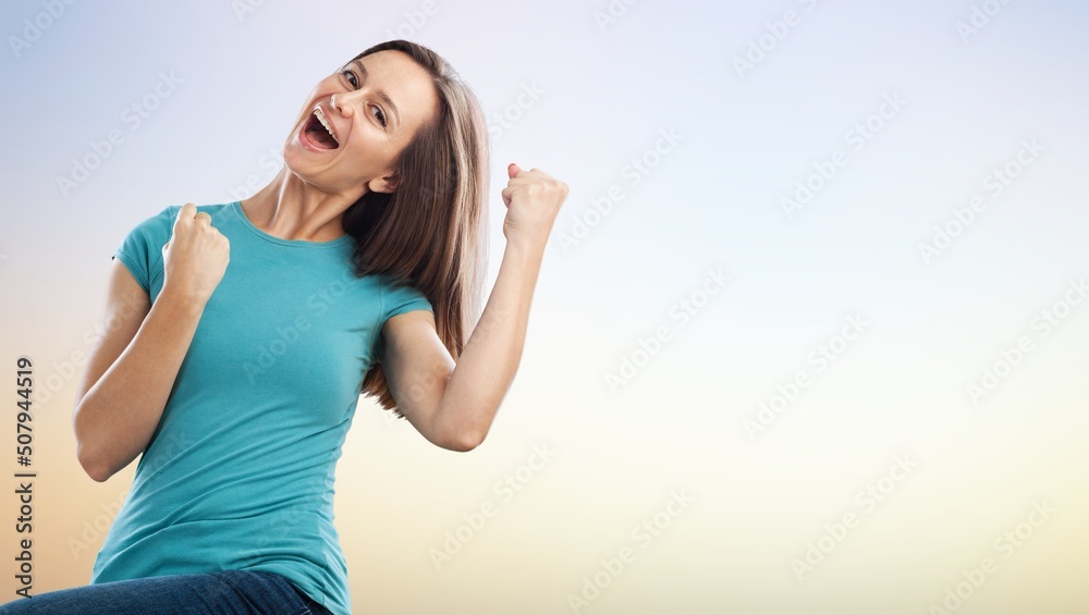 Young female with raised hands celebrating success cheerful positive woman with raised hands