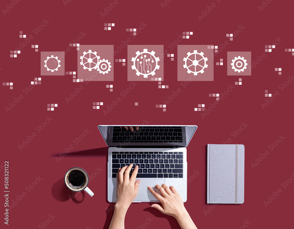 Automation concept with person using a laptop computer