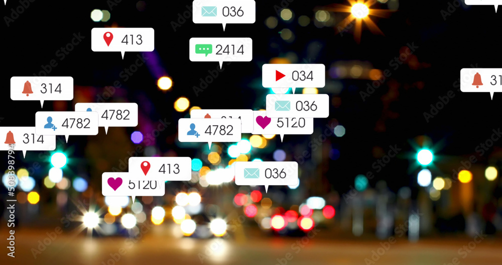 Image of social media icons and numbers over out of focus city and car lights