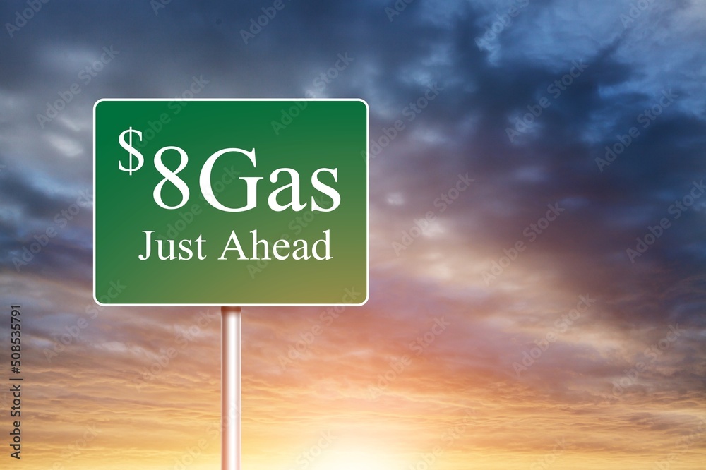 $8 Gas Green letter on Road Sign Against Cloudy Sky.