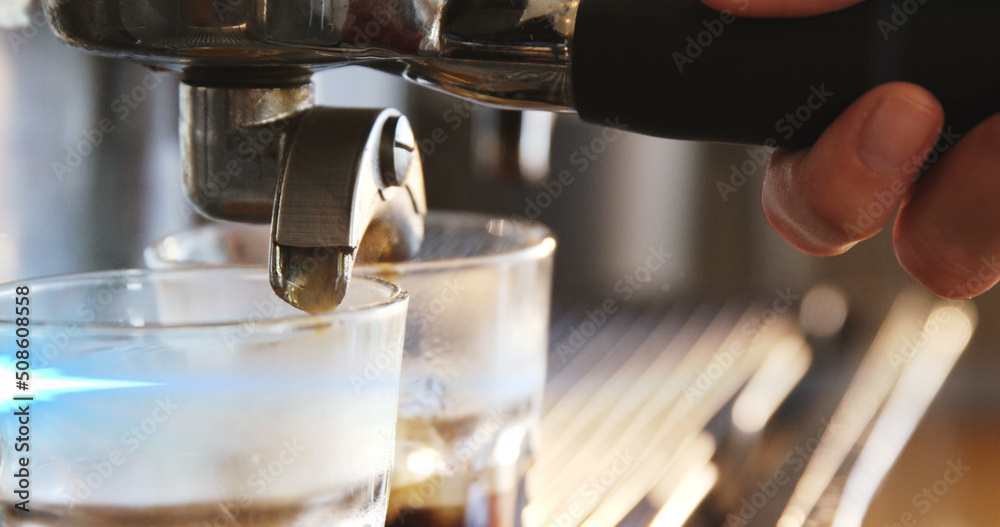 Image of light spots over biracial man using coffee machine