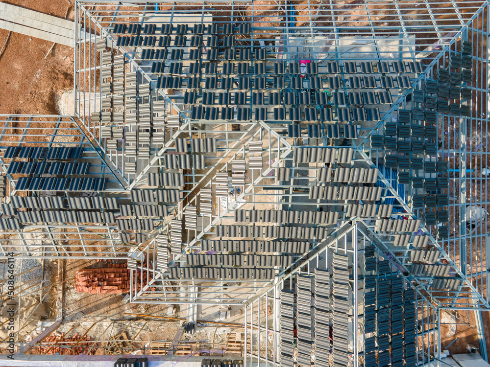 Top view of Concrete or CPAC cement roof tiles on the new roof are under construction. residential b