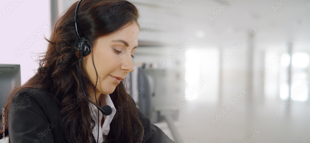 Business people wearing headset working in office to support remote customer or colleague. Call cent