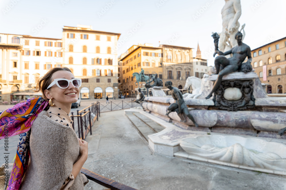 Young woman traveling famous italian landmarks in Florence city. Enjoying beautiful architecture and