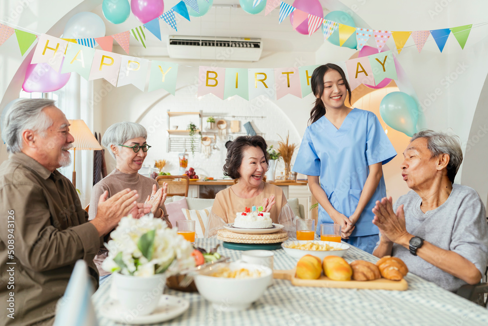 birthday party at senior daycare,group of asian female elder male female laugh smile positive conver