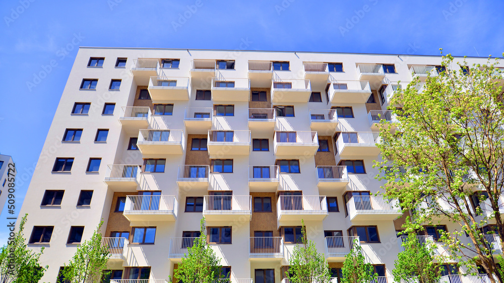 Apartment residential house and home facade architecture and outdoor facilities. Blue sky on the bac