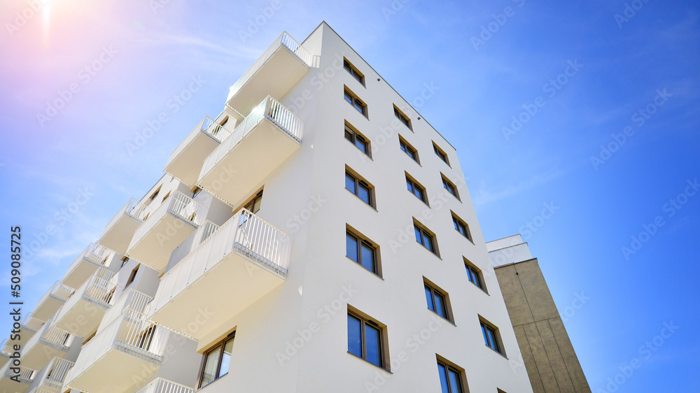 Apartment residential house and home facade architecture and outdoor facilities. Blue sky on the bac