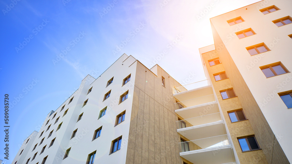 Apartment residential house and home facade architecture and outdoor facilities. Blue sky on the bac