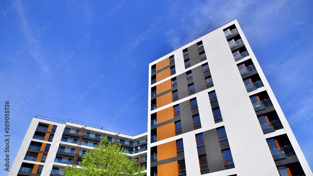 Apartment residential house and home facade architecture and outdoor facilities. Blue sky on the bac