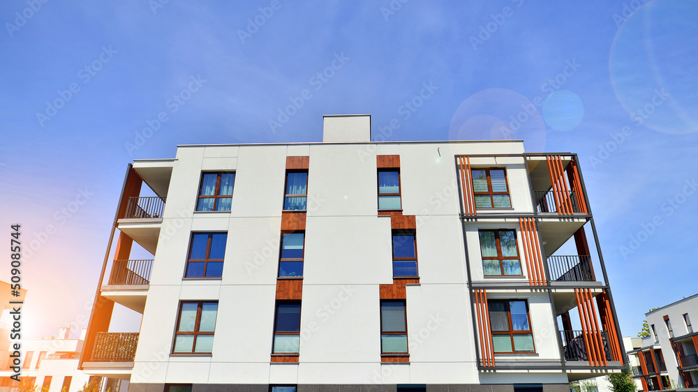 Apartment residential house and home facade architecture and outdoor facilities. Blue sky on the bac