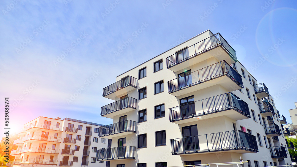 Apartment residential house and home facade architecture and outdoor facilities. Blue sky on the bac