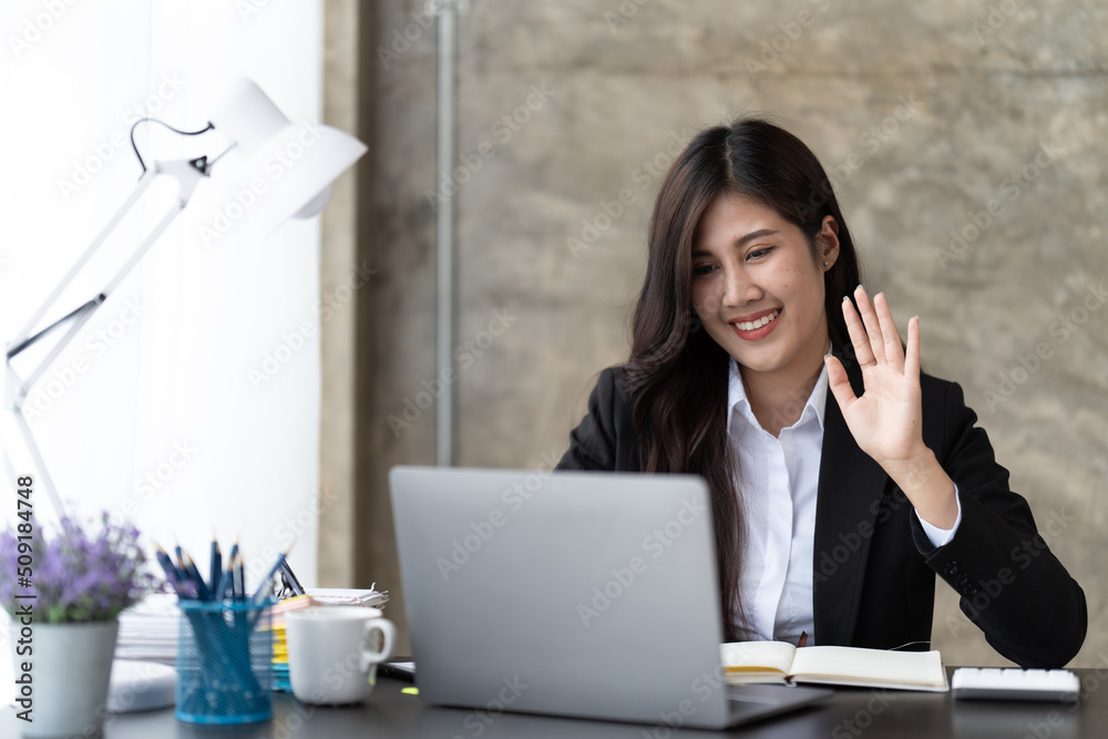 Young Asian businesswoman work at home and virtual video conference meeting with colleagues business