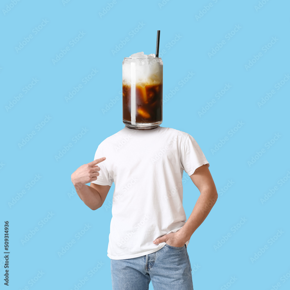 Man with glass of tasty cocktail instead of his head on light blue background