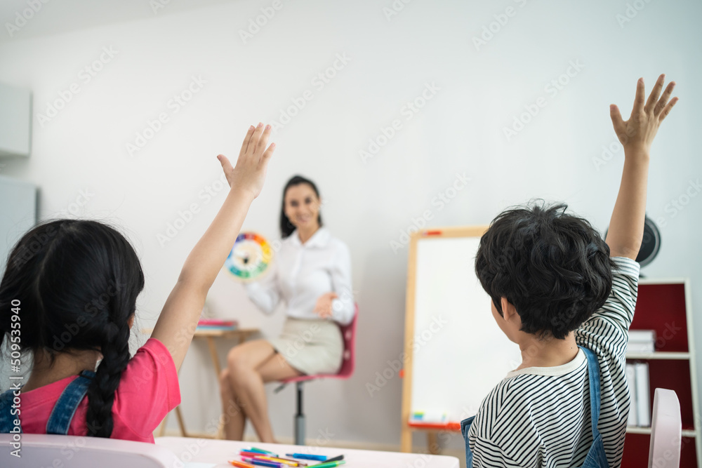 Caucasian beautiful woman teacher teach fun activity to kids at school	