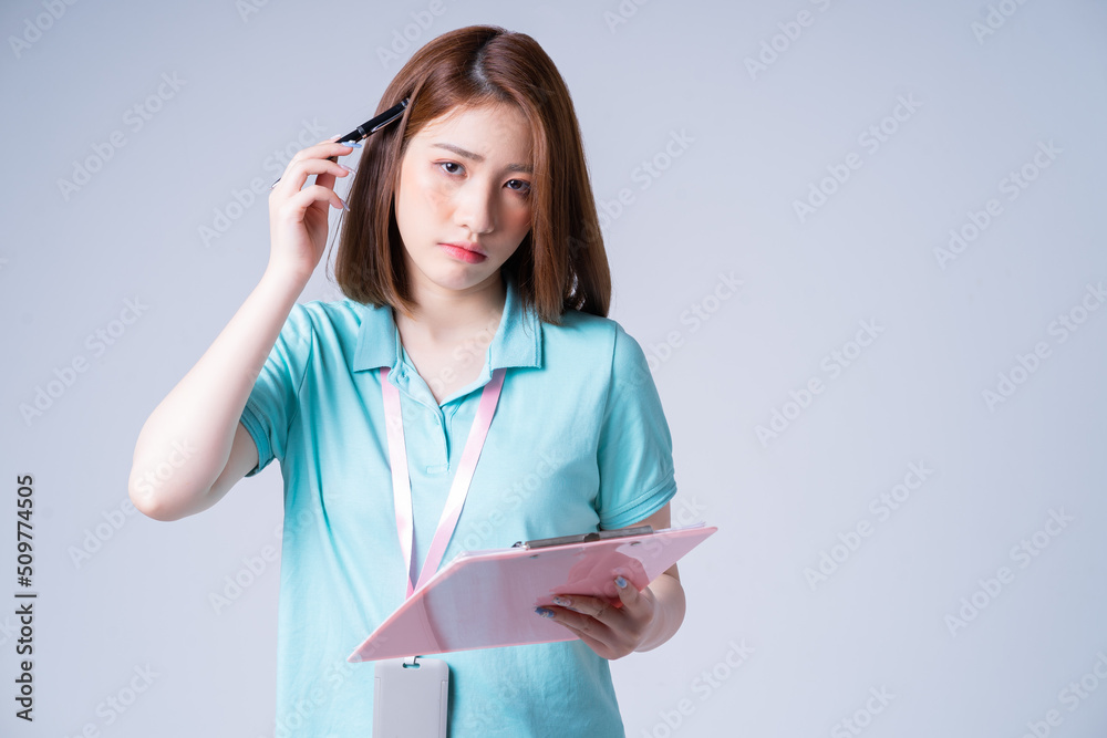 Portrait of young Asian businesswoman on white background