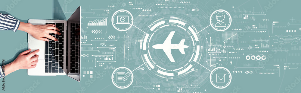 Flight ticket booking concept with person using a laptop computer