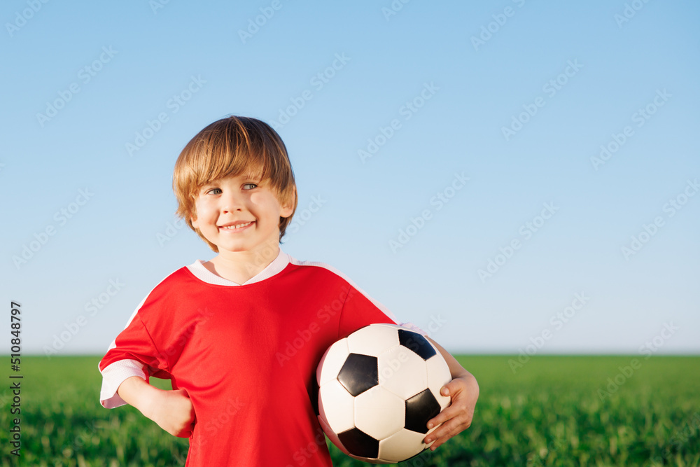 Child is pretending to be a soccer player