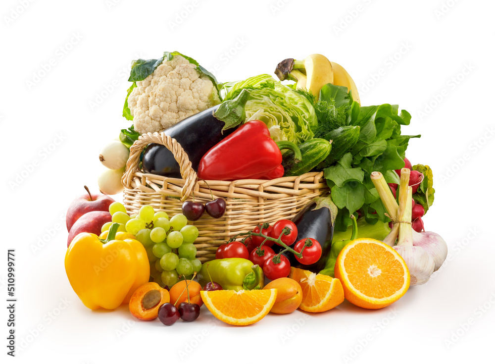 Vegetables and fruits in wicker basket isolated. Organic vegetable on white background