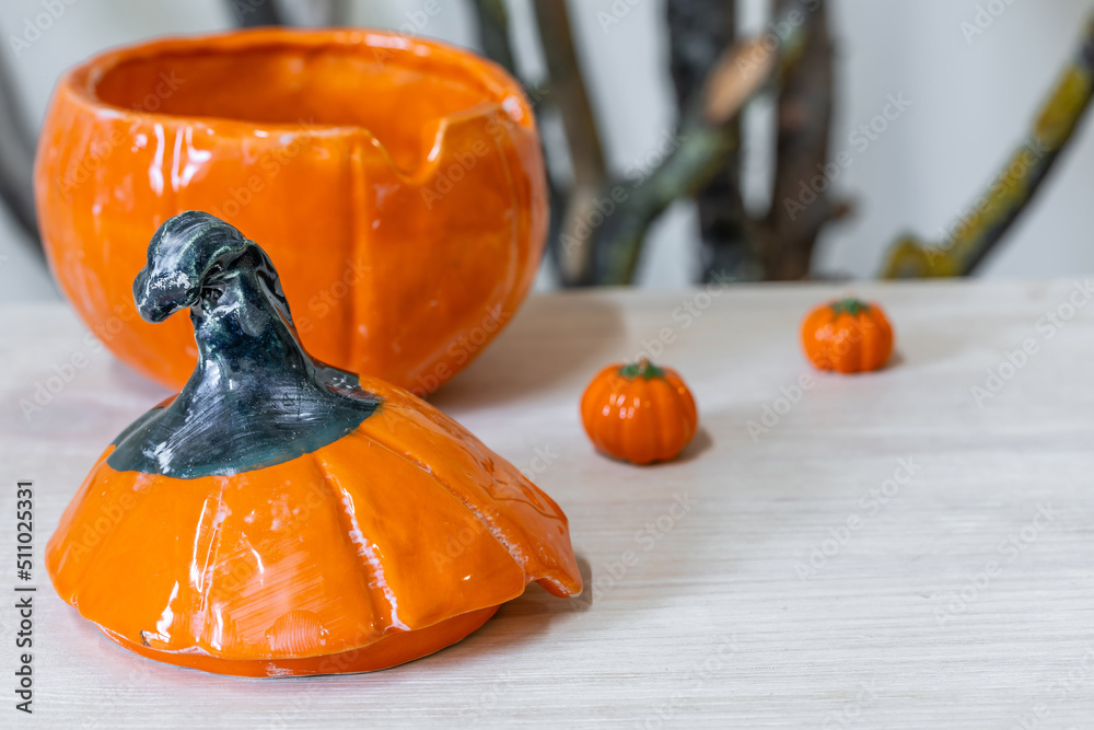 Handmade ceramic pumpkin bowl. Selective focus.