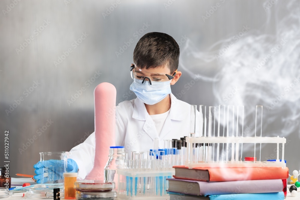 Young scientist stage in laboratory, doing experiment