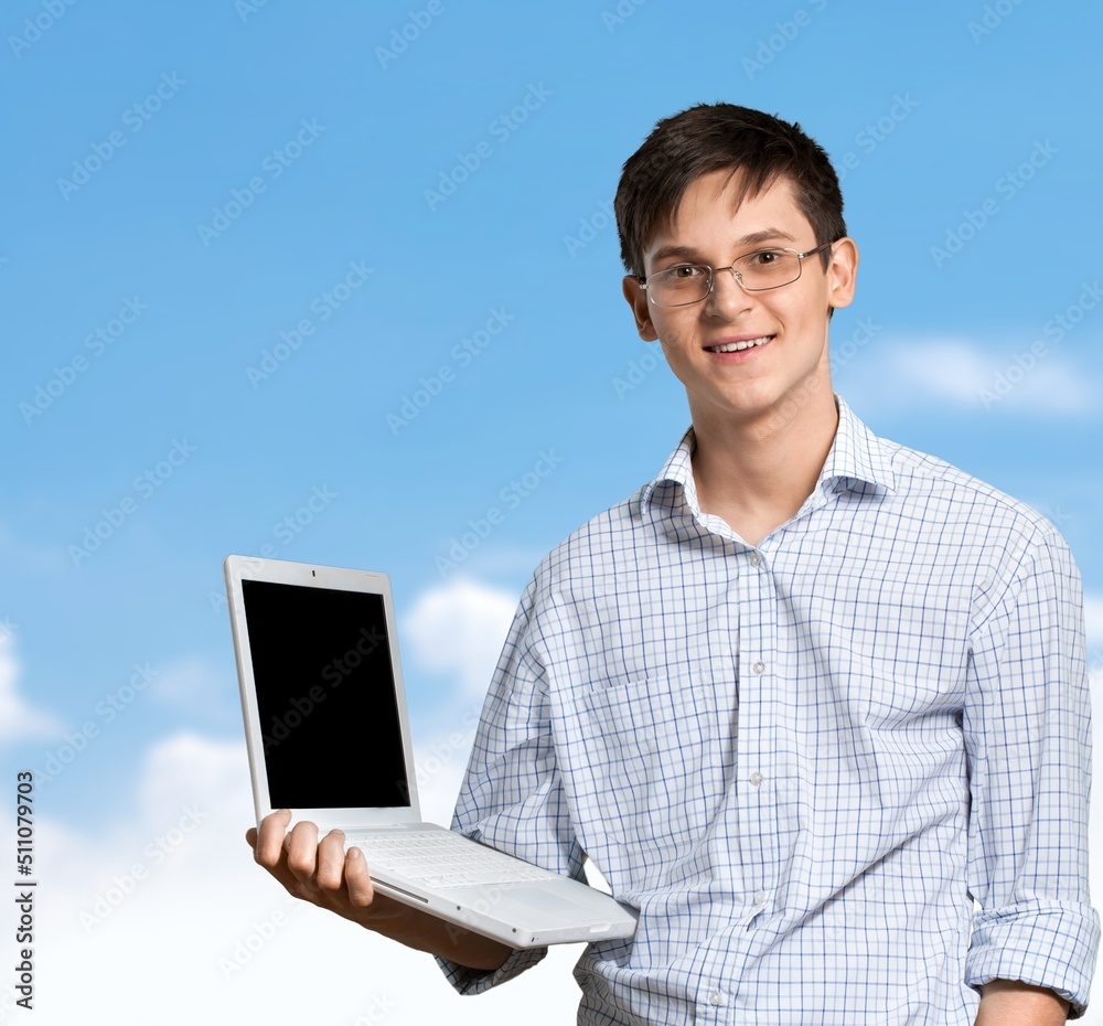 Shocked impressed surprised young man student coder programmer having idea, using laptop for remote 