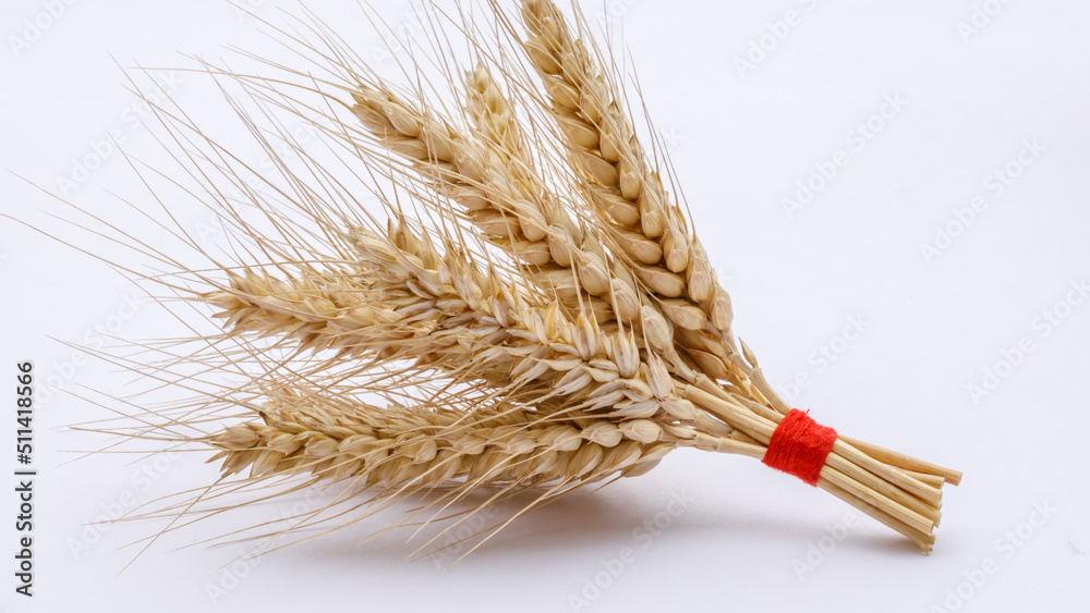 Ripe ears of wheat on a wooden board