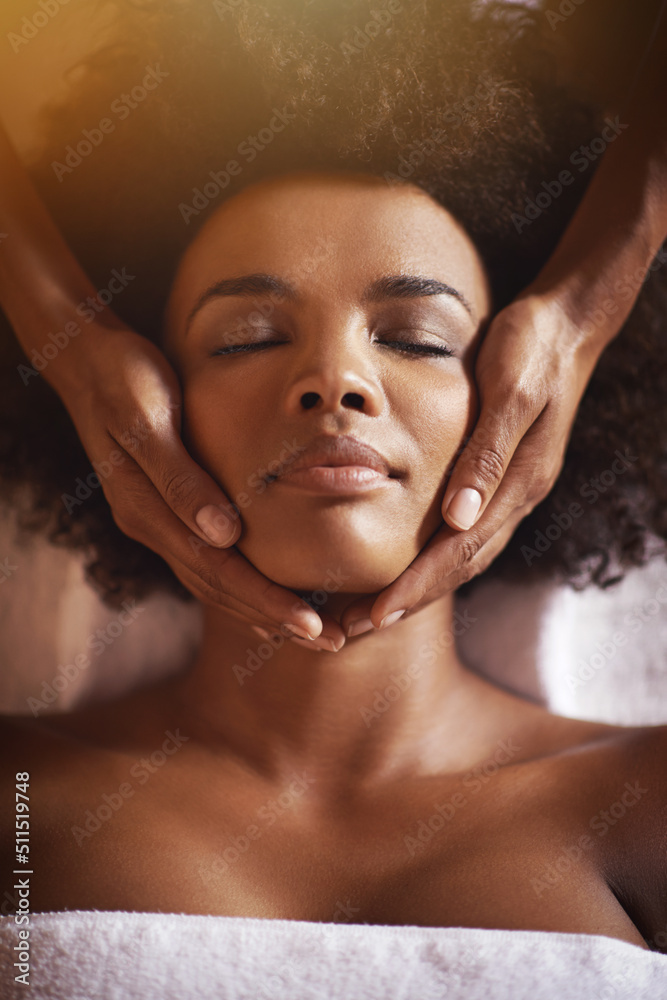 This is just what she needed. Shot of a young woman getting a head massage at a beauty spa.