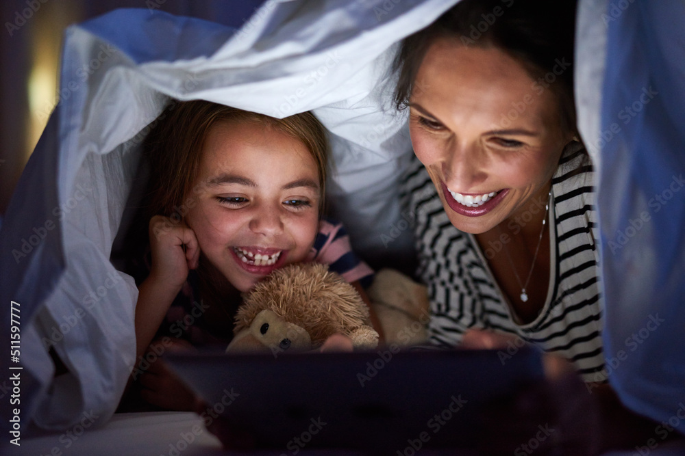 Can we read another one, Mom. Cropped shot of an attractive young woman reading her daughter a bedti