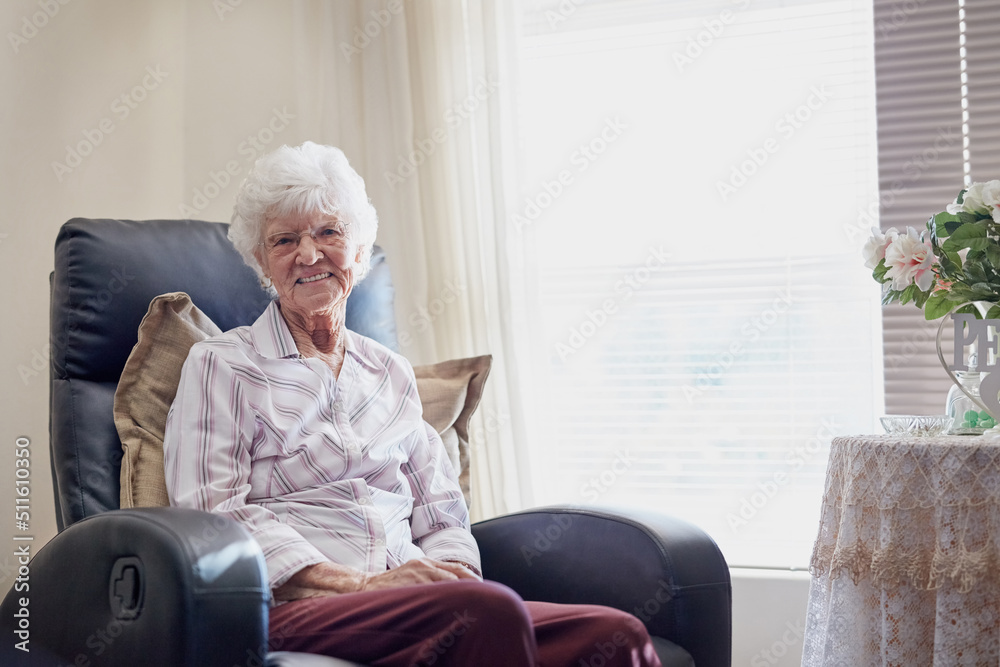 I sure am glad I planned for a relaxing retirement. Portrait of a happy elderly woman relaxing on a 