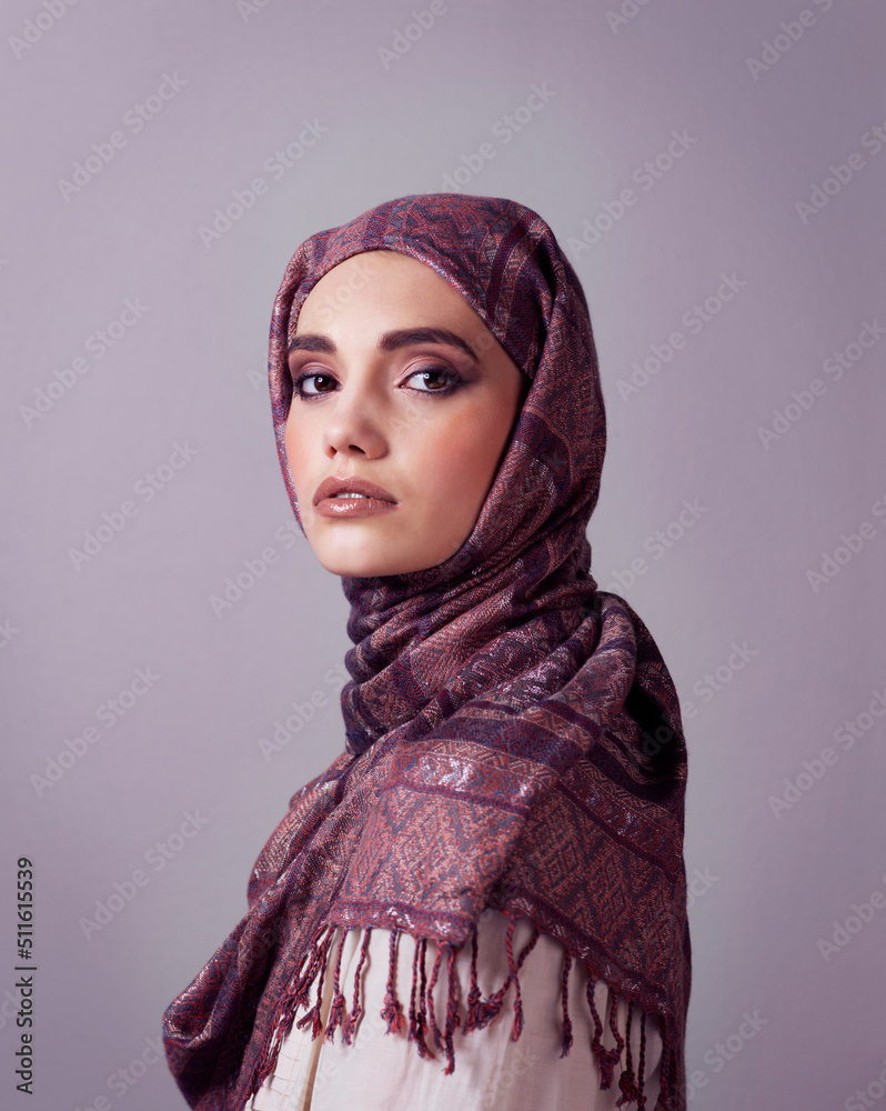 Always be your own kind of beautiful. Studio portrait of a cheerful young woman wearing a colorful h