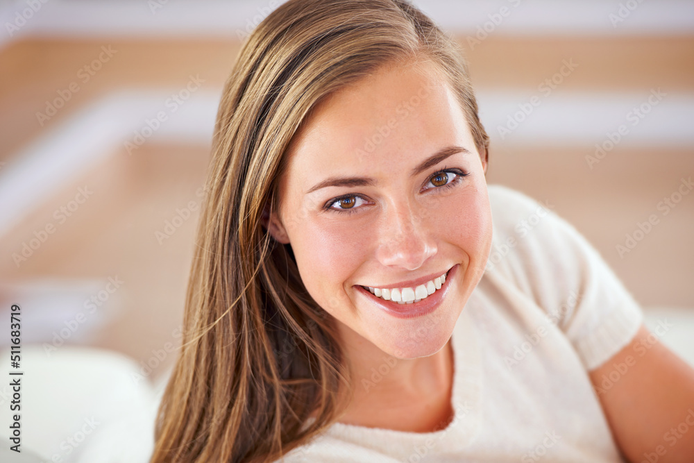 My home is my getaway. Portrait of an attractive young woman resting her head on her hands.