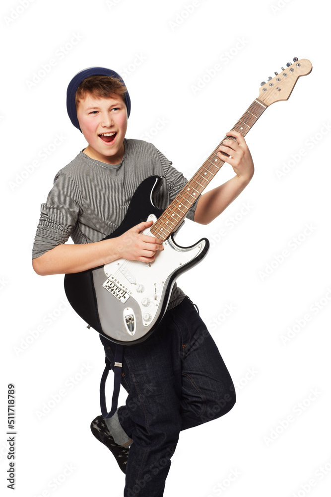 Rockin out. A teenage boy playing a n electric guitar.