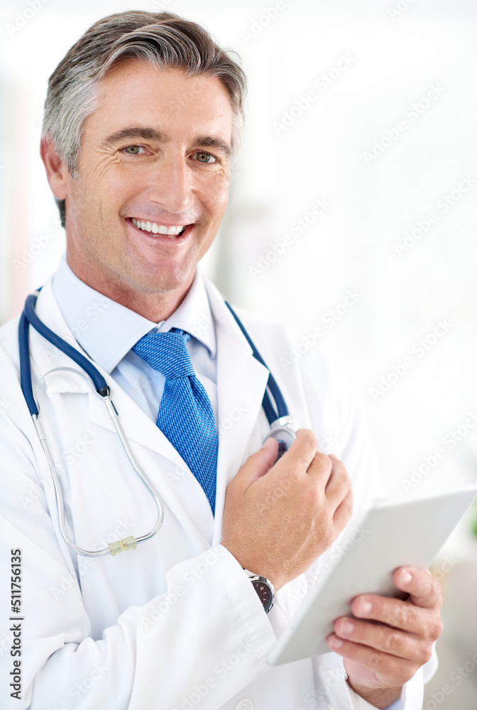 The results are in. Portrait of a doctor holding a digital tablet while standing in a hospital corri