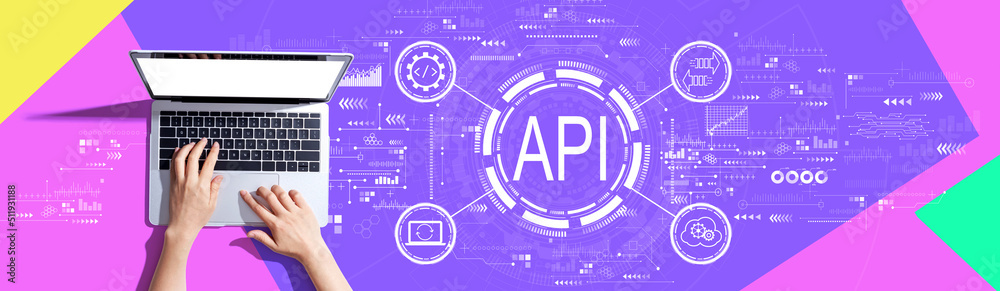 API - application programming interface concept with person using a laptop computer