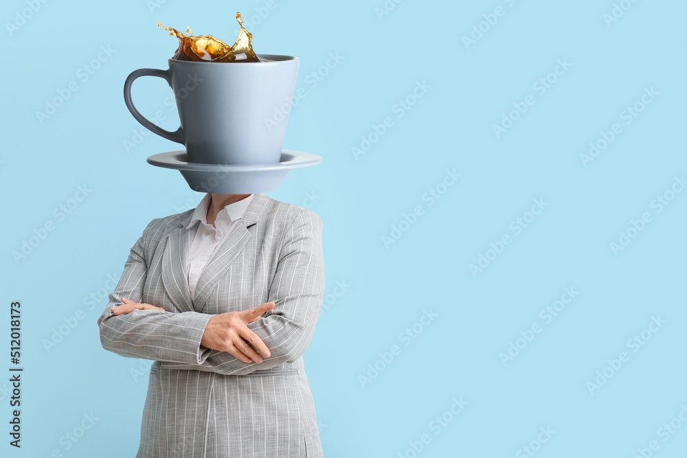 Businesswoman with cup of hot coffee instead of her head on light blue background