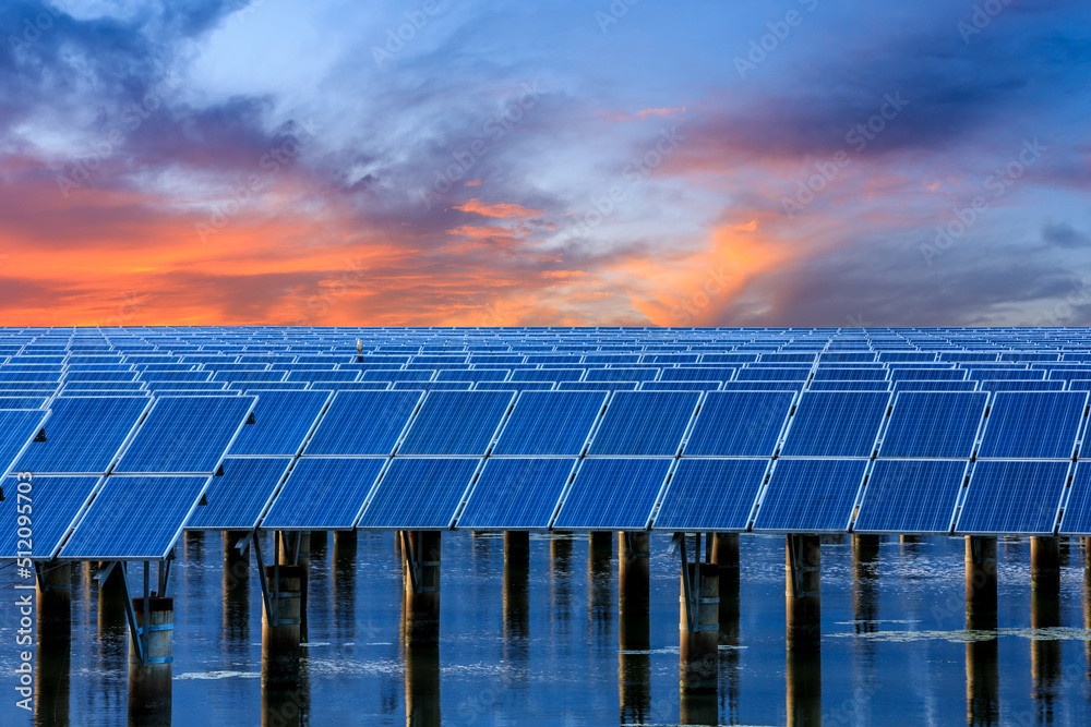 Solar power station at beautiful sunset. solar photovoltaic power station on water. green energy con