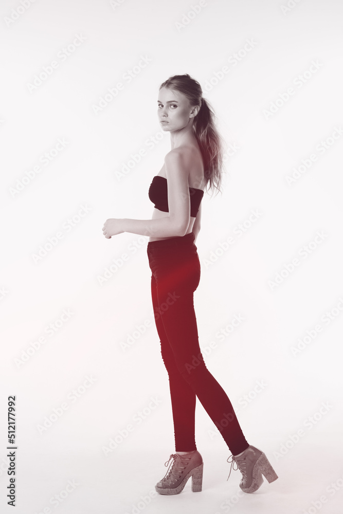 Simply beautiful. Full length shot of a gorgeous young woman standing in the studio.