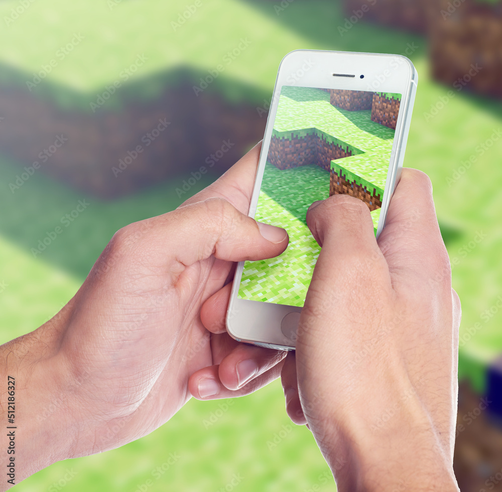 Closeup shot of somebody playing a popular video game on a smartphone. ALL design on this image is c