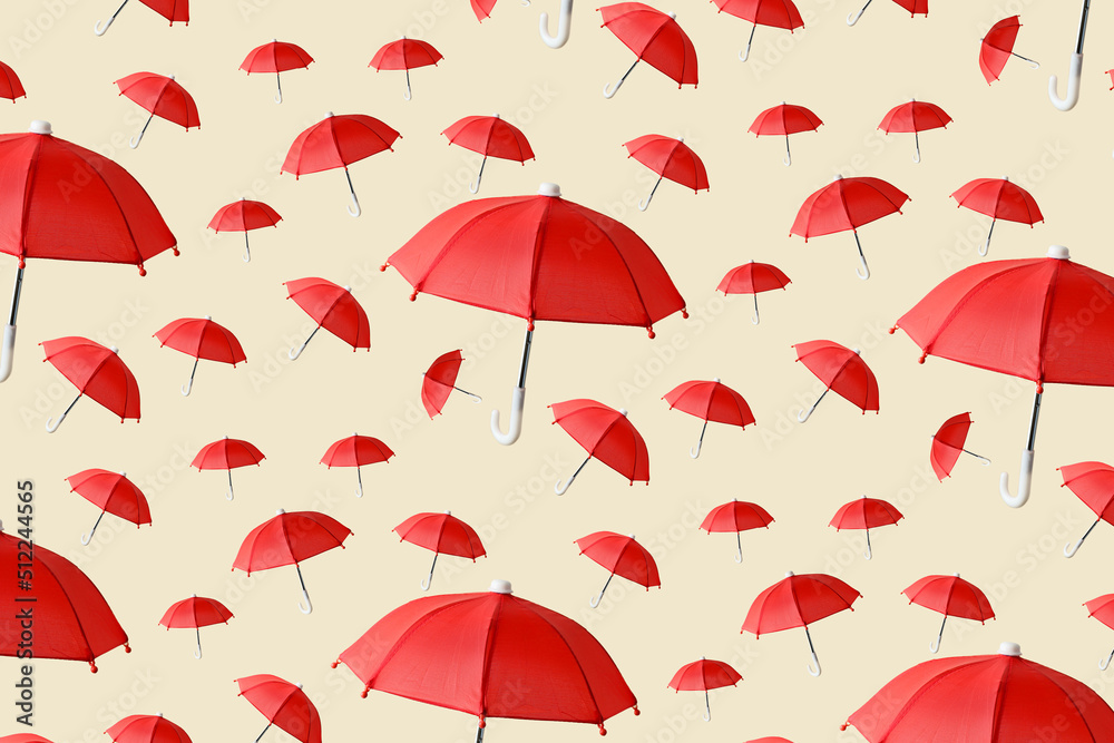 Many red umbrellas on beige background. Pattern for design