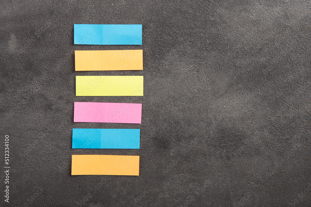 Colorful sticky notes on the blank blackboard