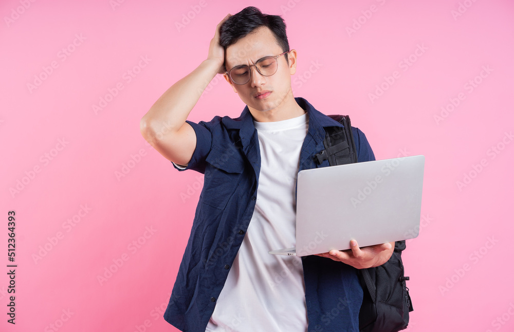 Image of young Asian college student on pink background