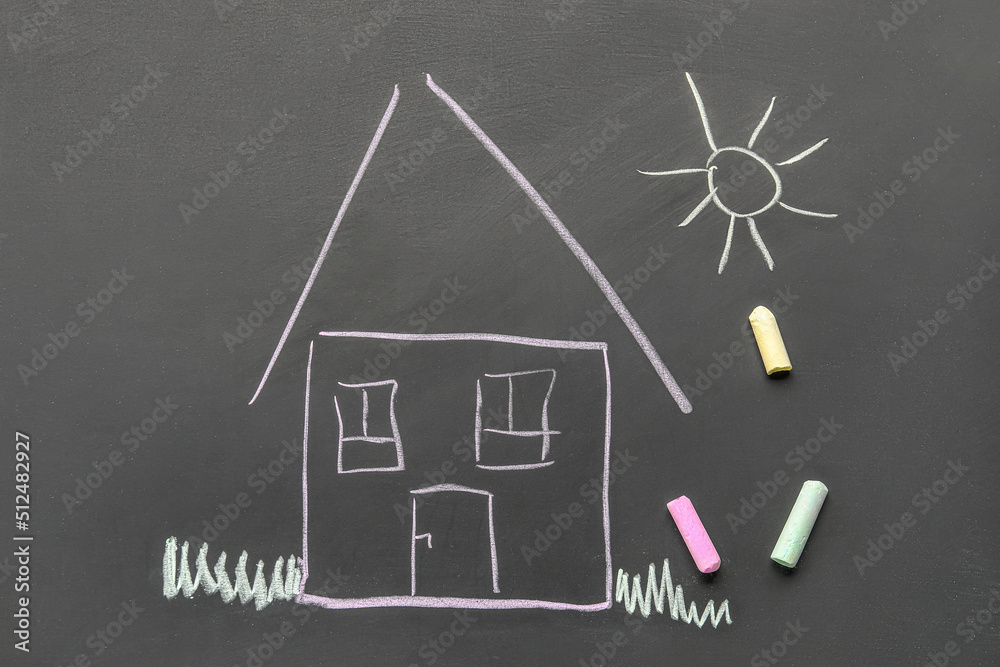 Drawn house and sun with chalks on blackboard