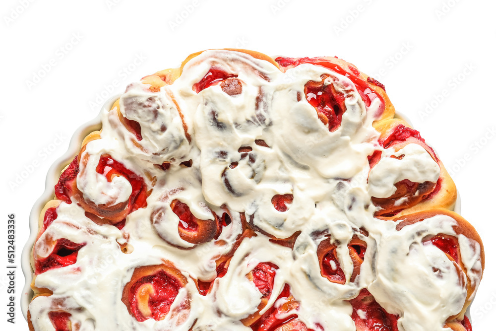 Baking dish with strawberry cinnamon rolls and cream on white background, top view