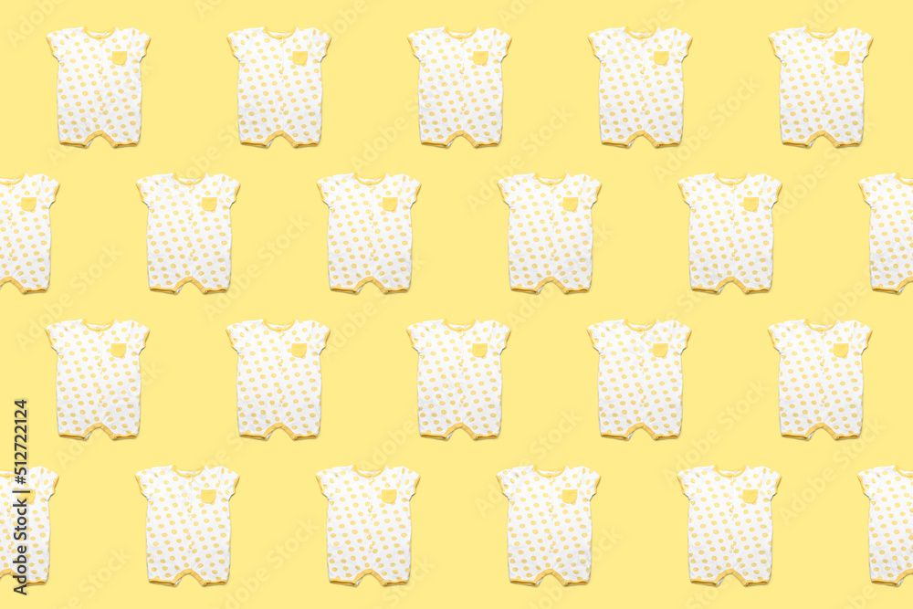 Baby clothes on color background