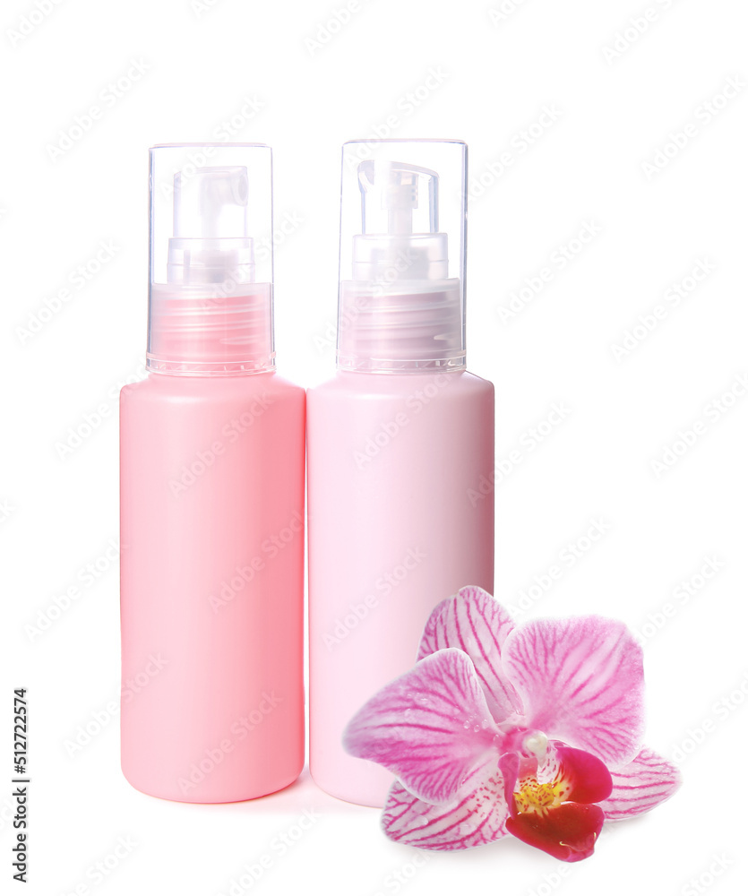 Set of travel bottles with body care cosmetics on white background