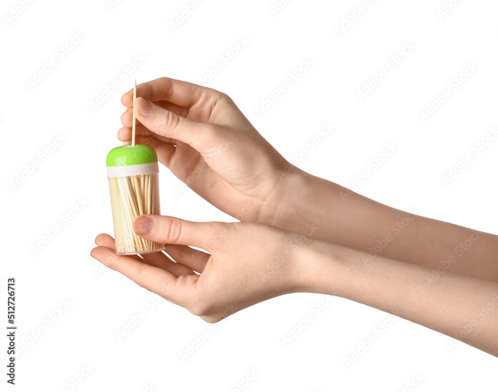 Woman taking bamboo toothpick from box on white background