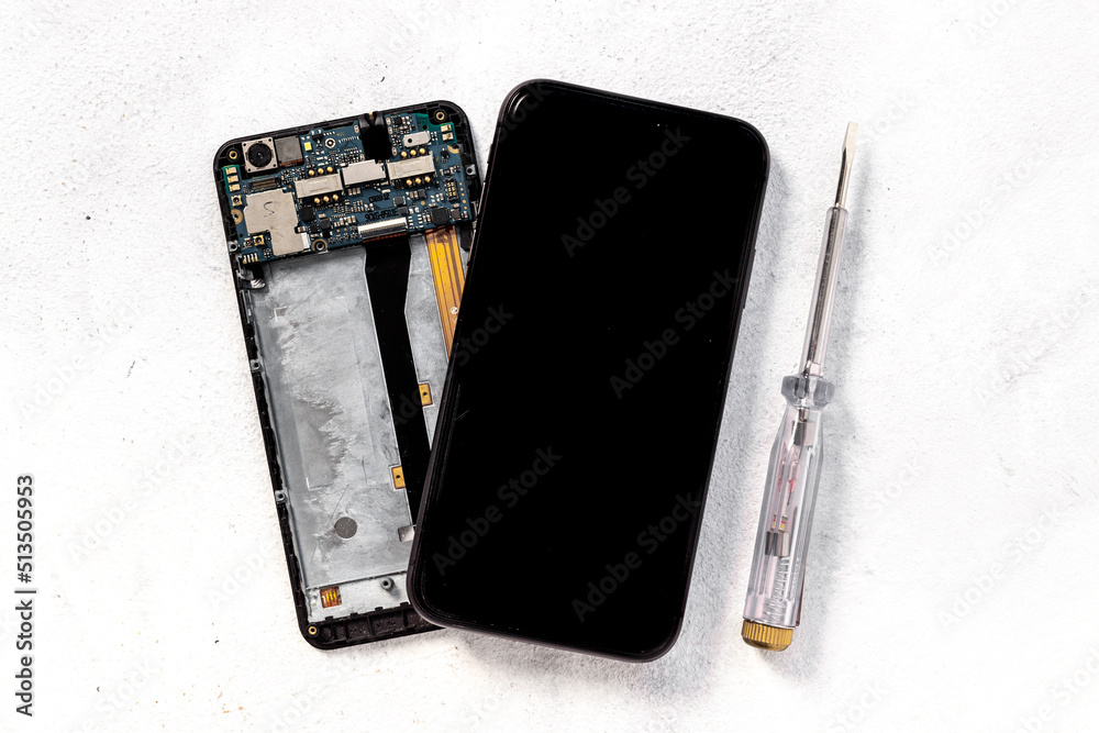 Repairing electronics circuit board - mobile phone with microchips