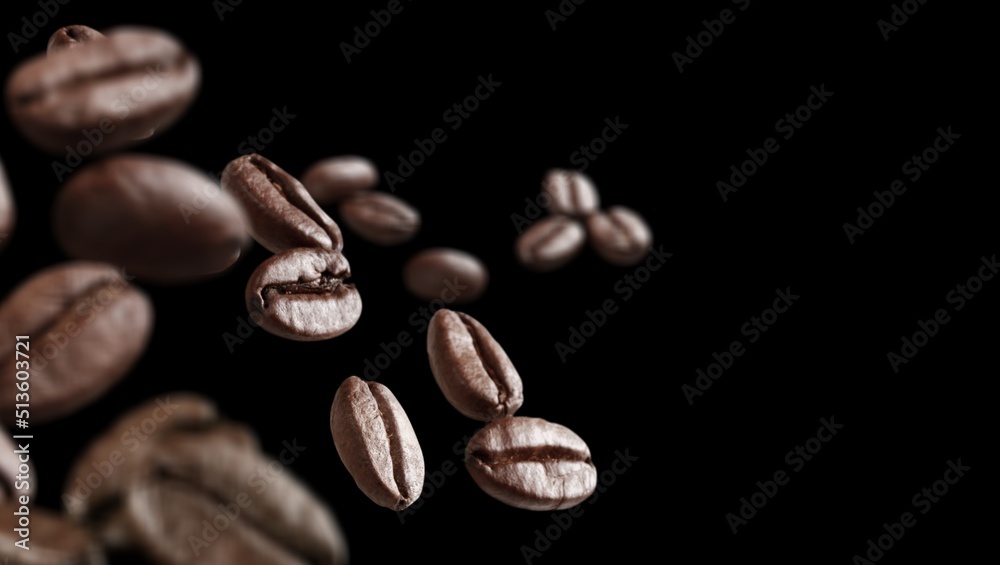 Aroma Coffee beans in flight on a dark background