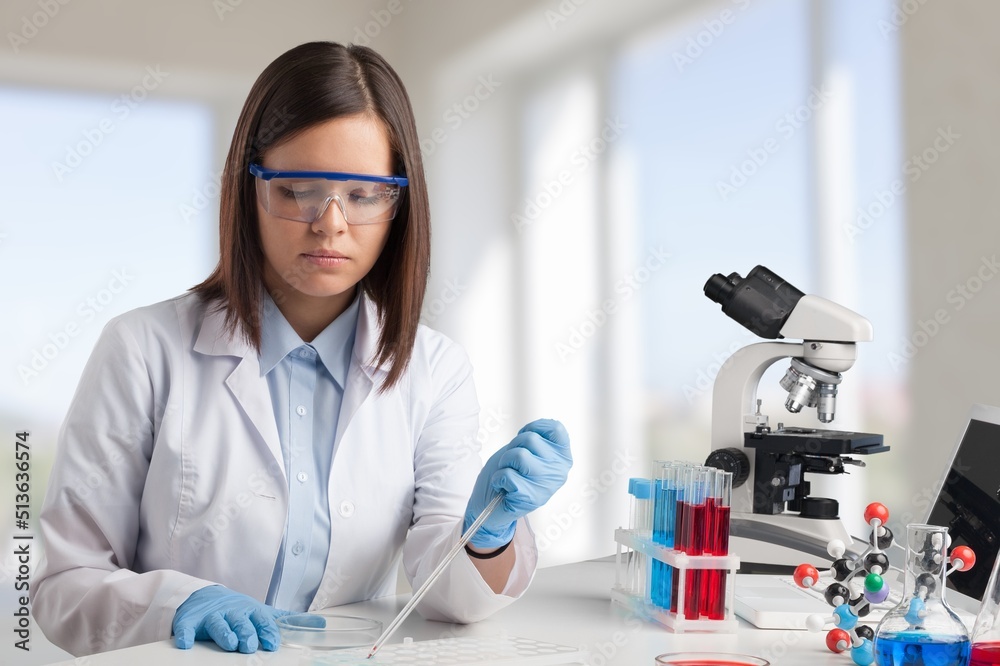 Female young Scientist Working in The Lab