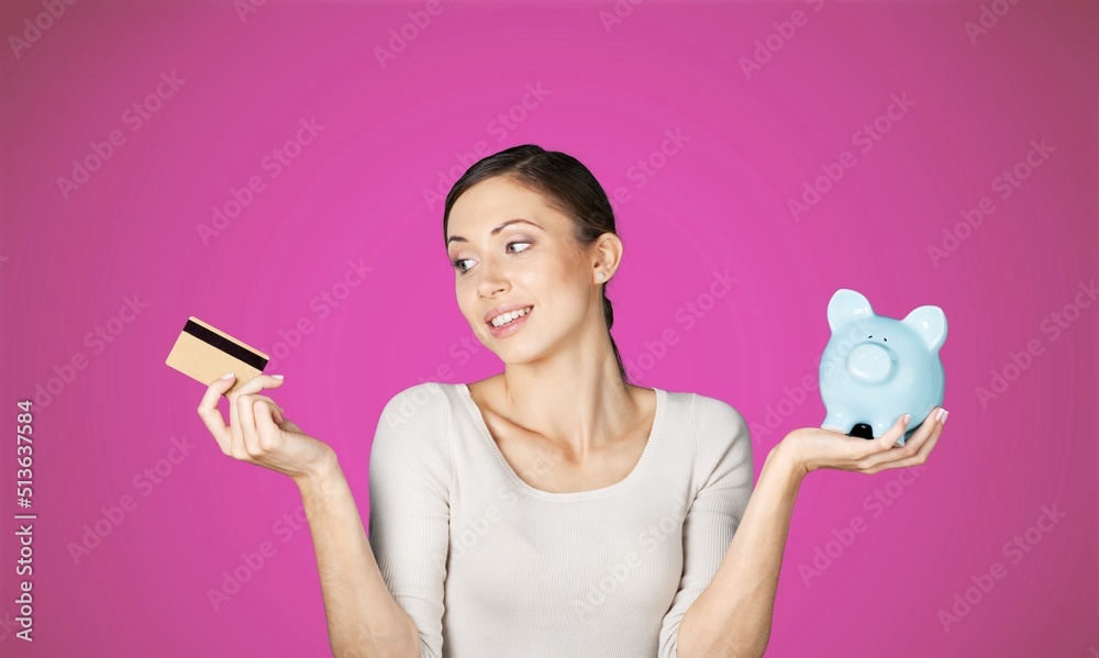 Beautiful women holds credit card. Online shopping and excited with success payment concept